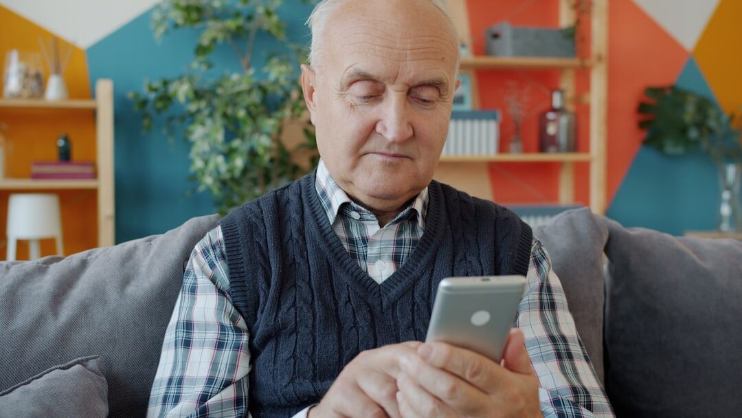 elderly person on phone