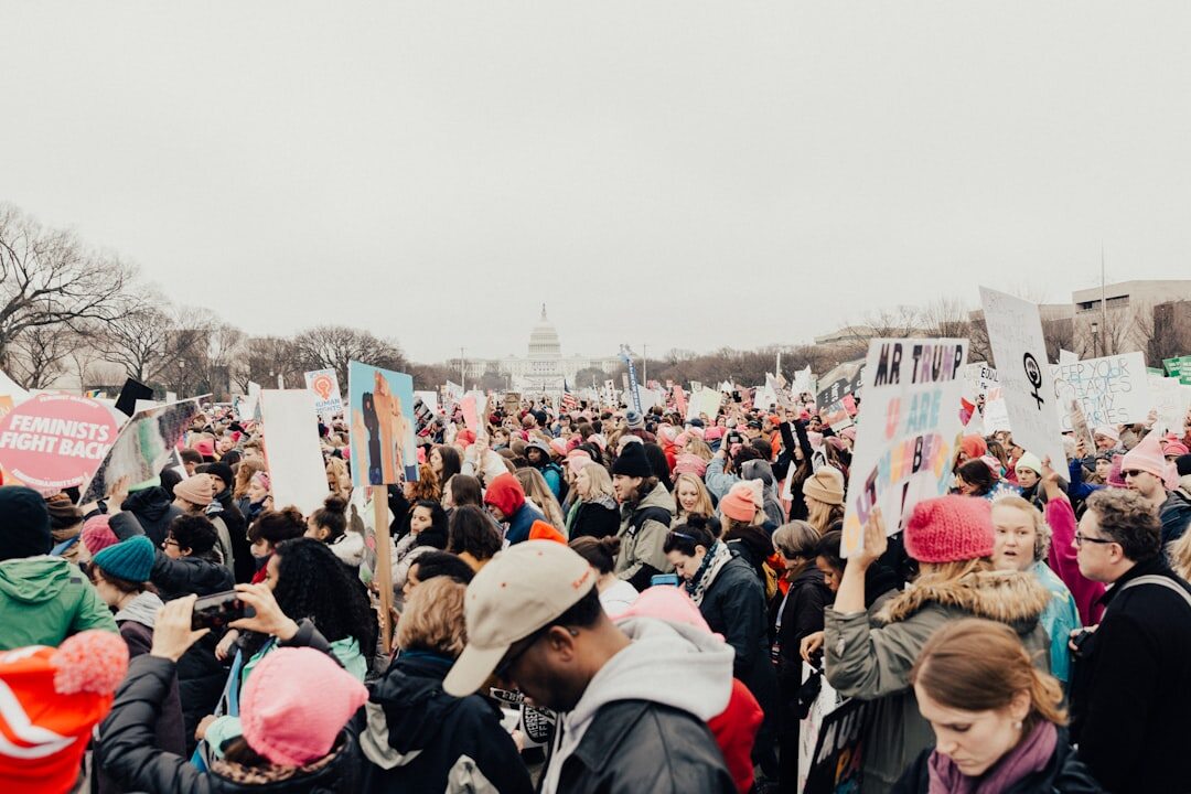 crowd protesting with signs